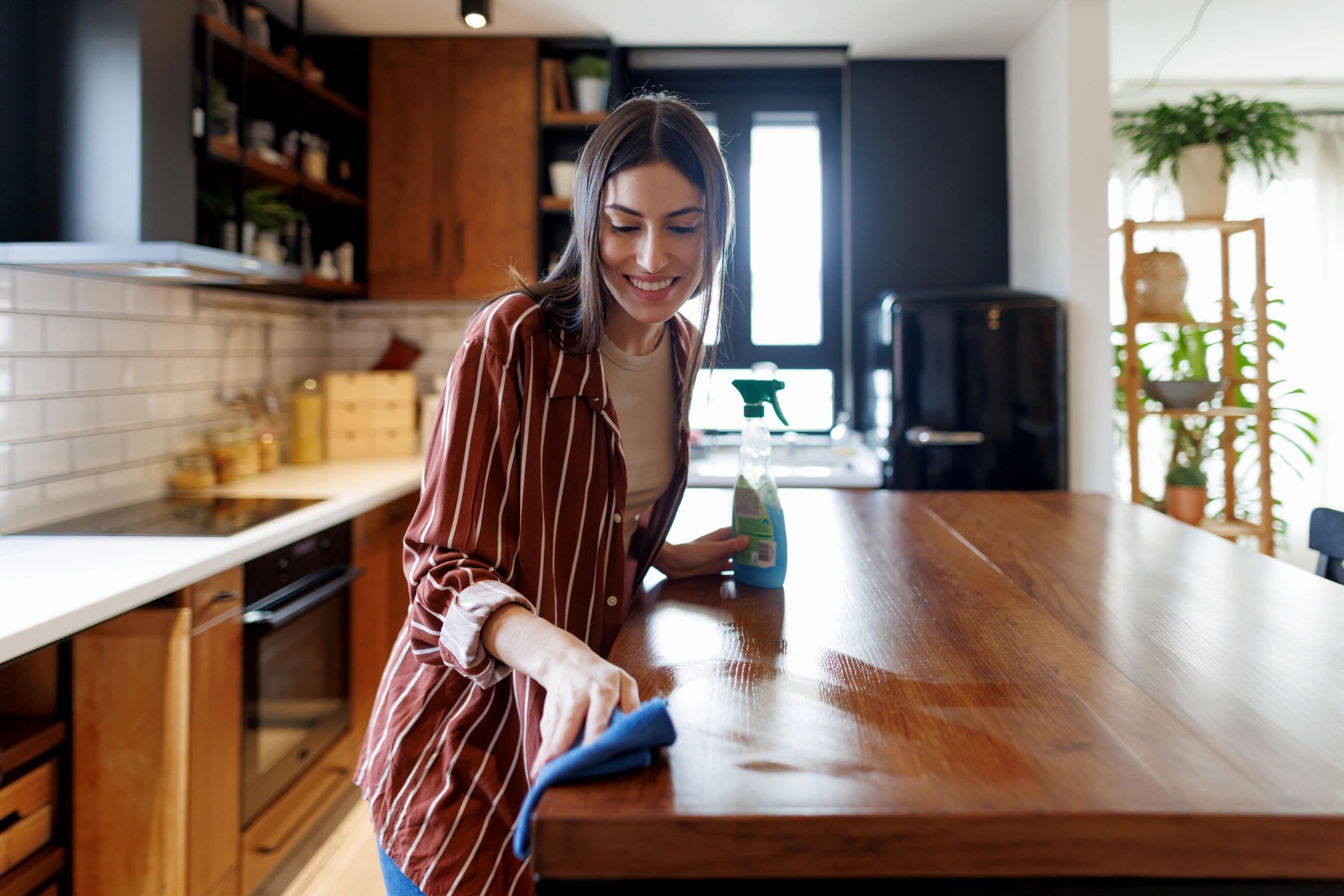 Professional cleaning a kitchen countertop